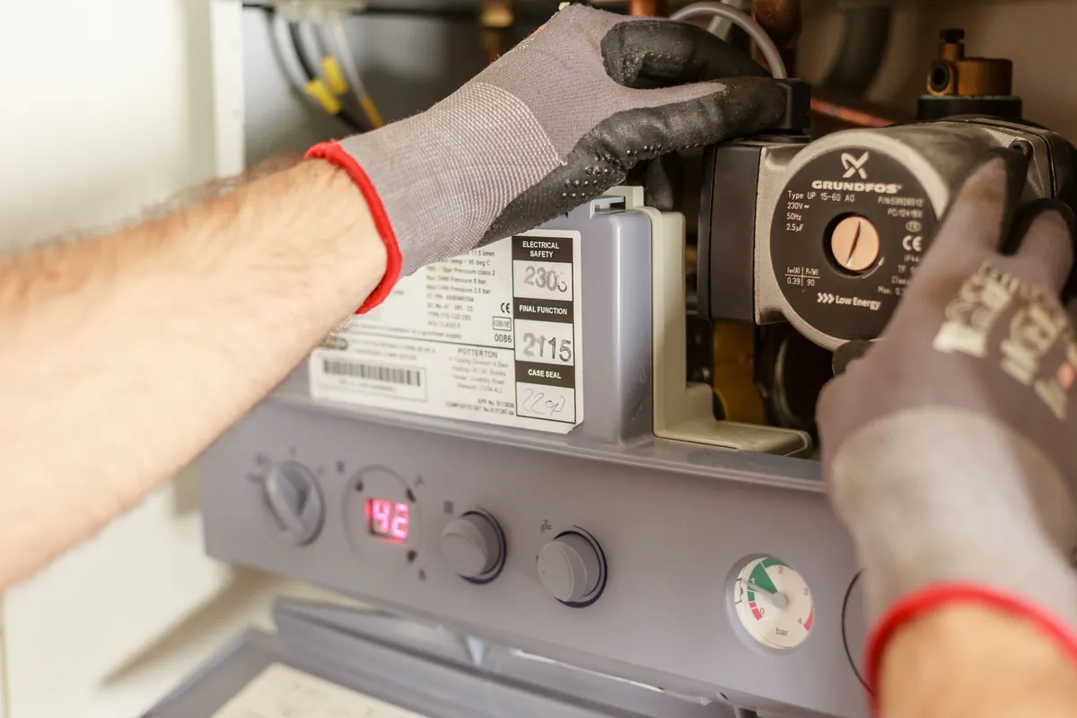 Hands on a boiler pump