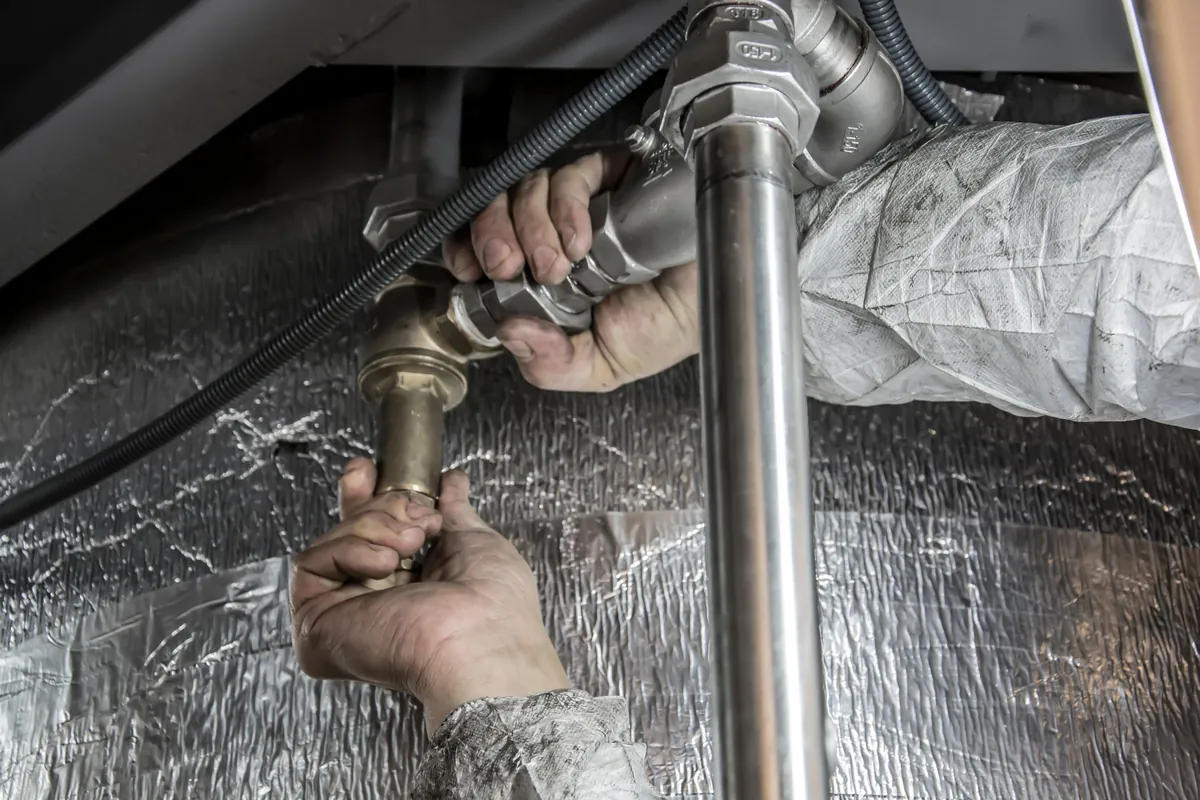 Steel pipework being connected