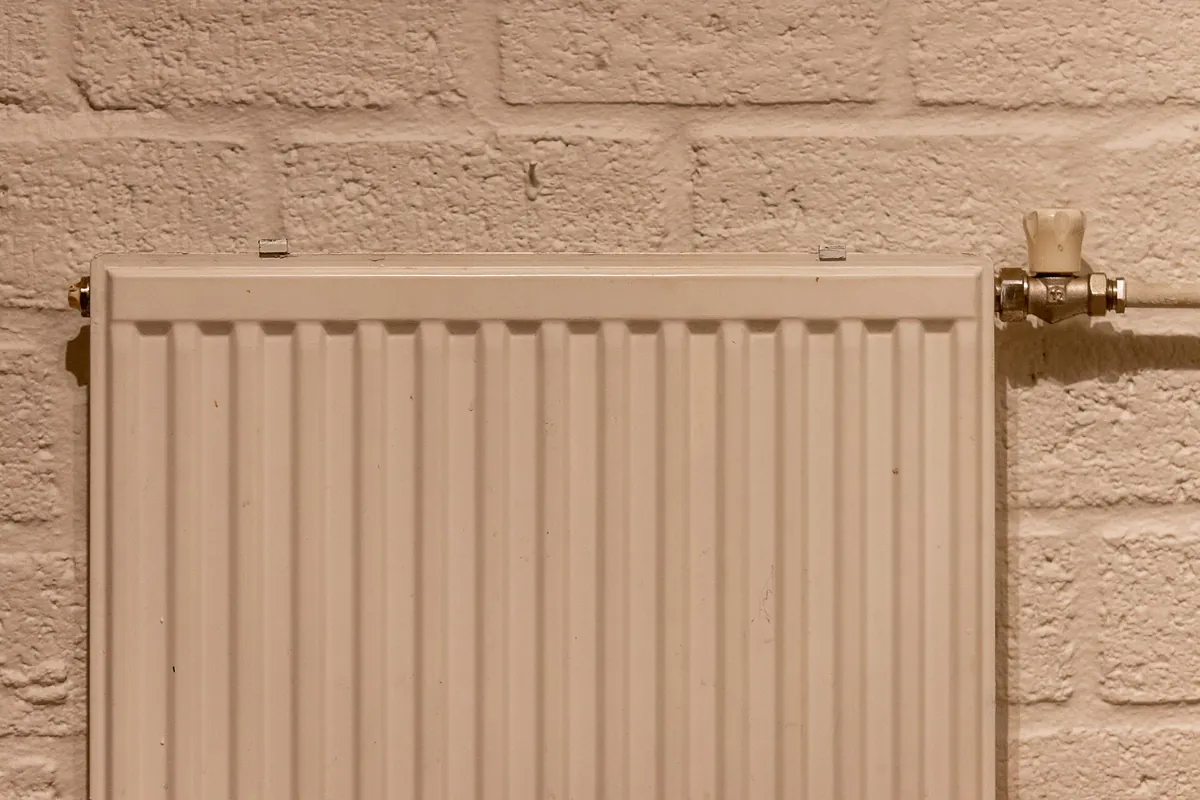 Panel radiator on a brick wall