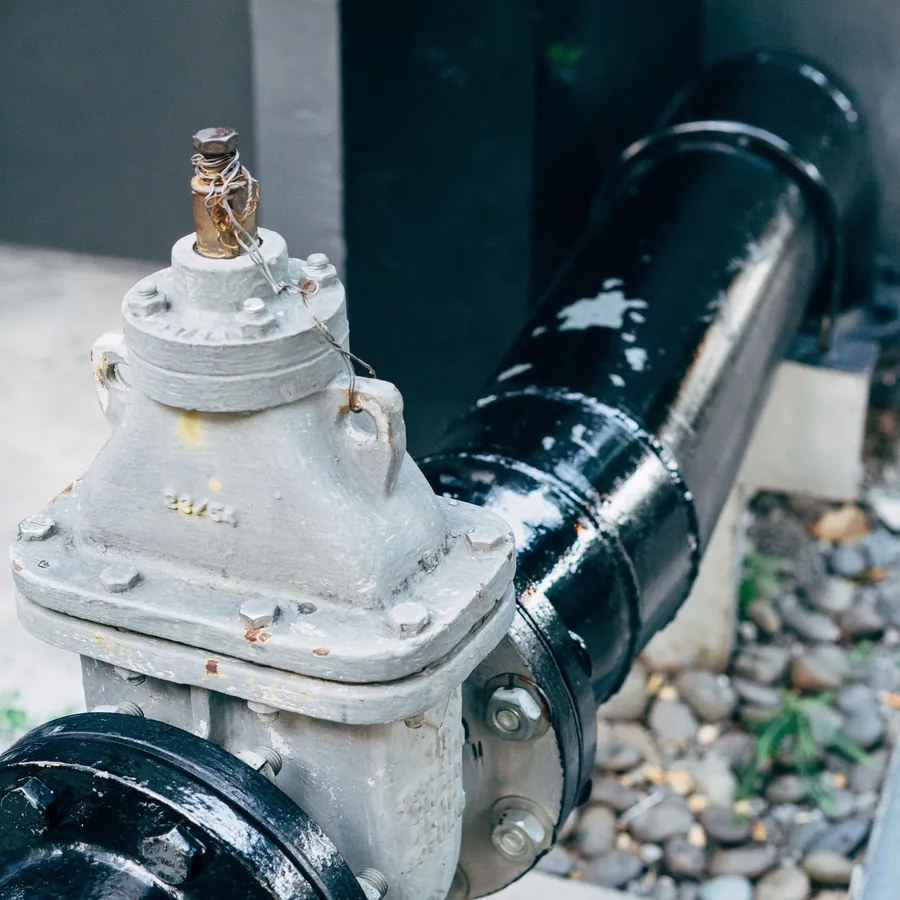 Plumbing valve on a black pipeline