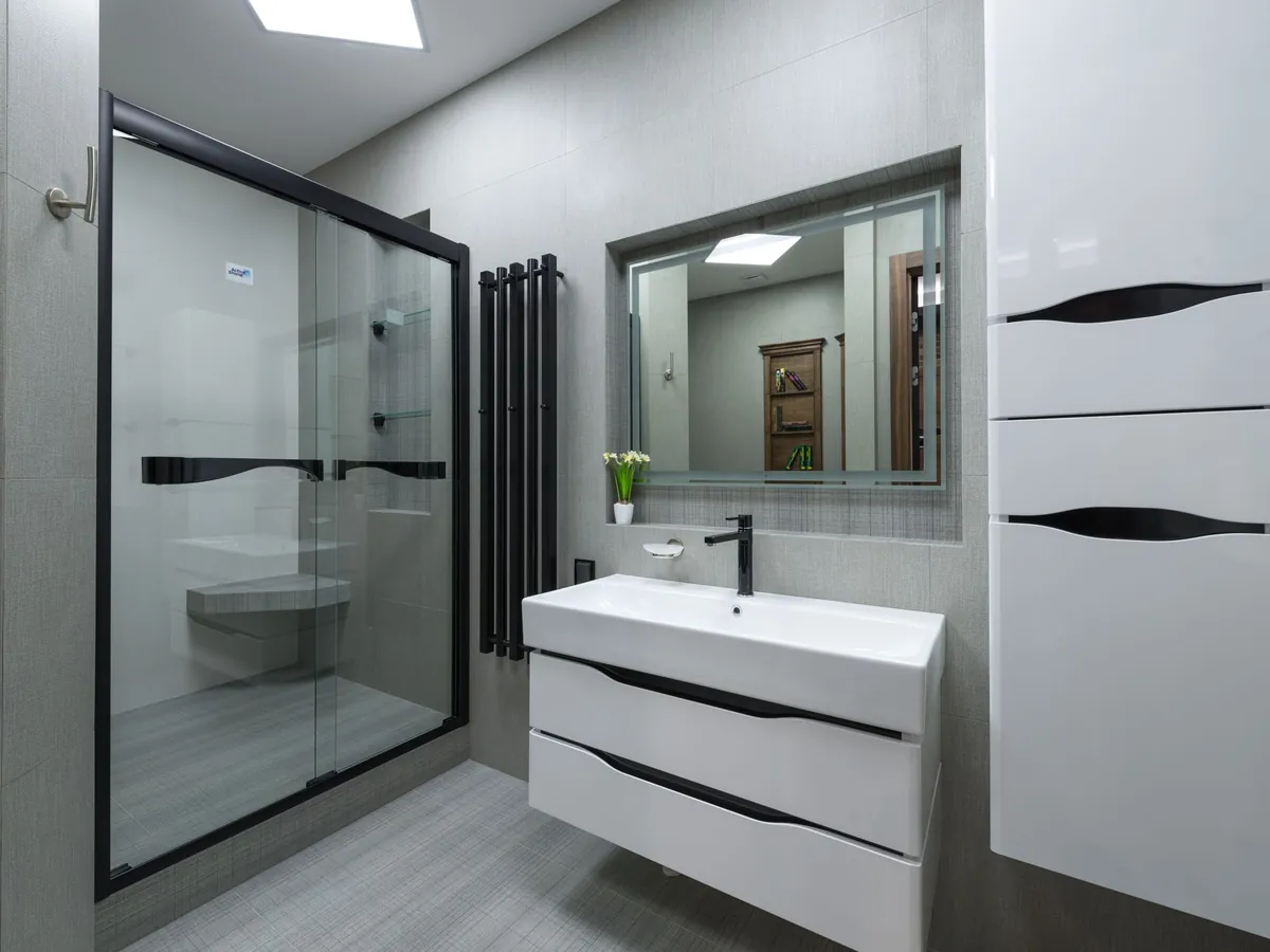 Newly fitted white bathroom with a walk-in shower